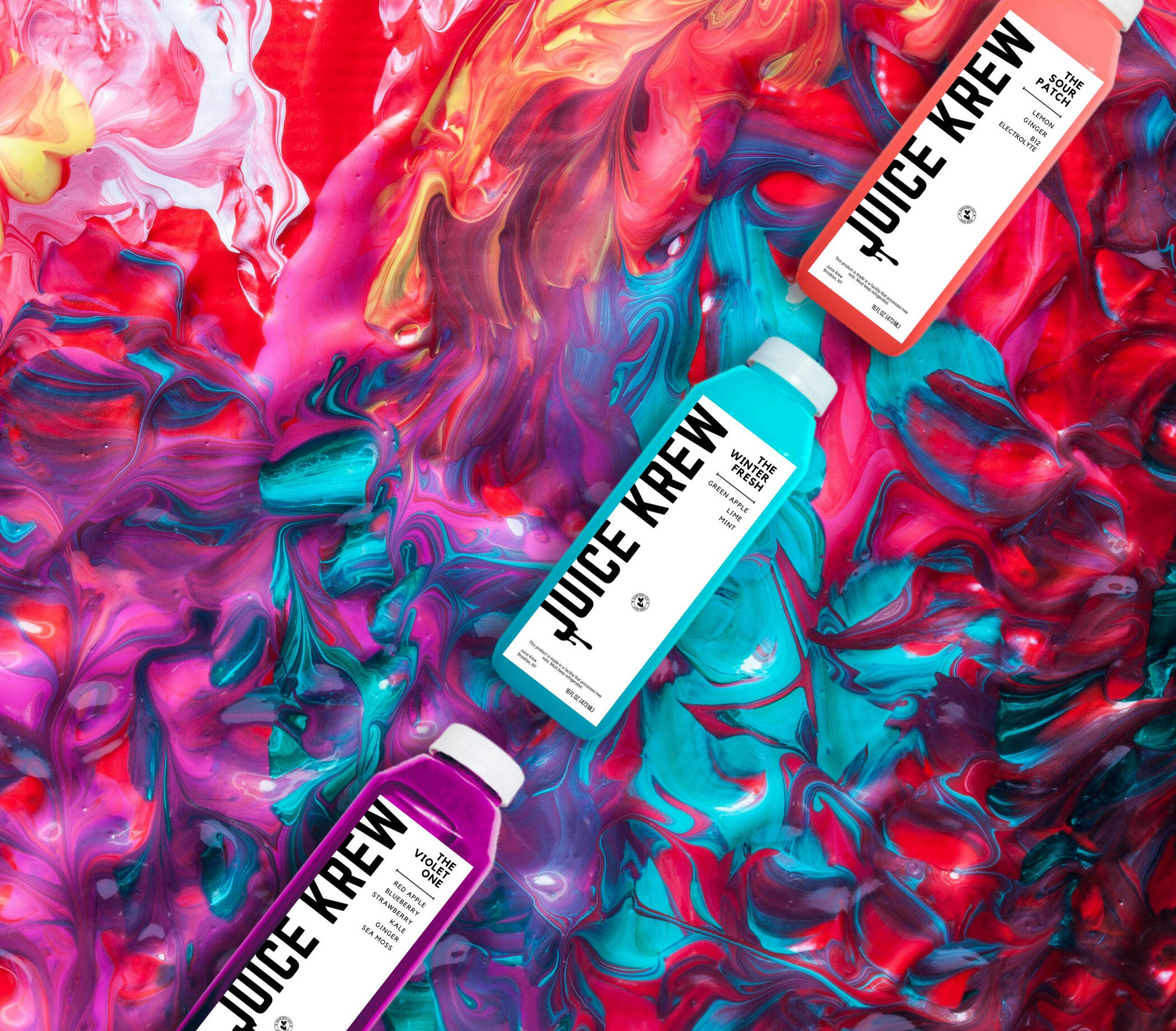 juice krew juice bottles on swirl background